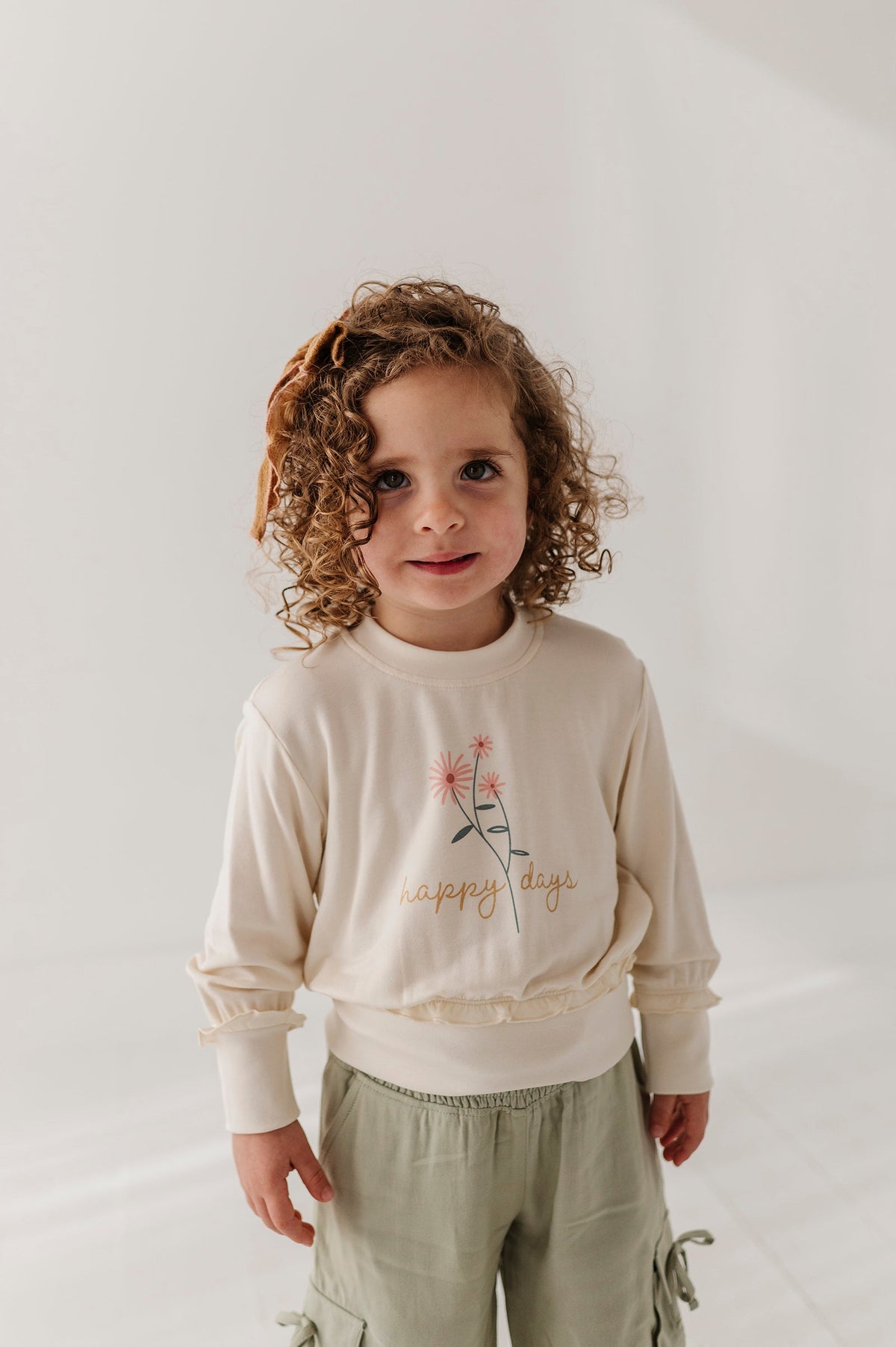 Girls Ruffle Hem Sweatshirt in Happy Days